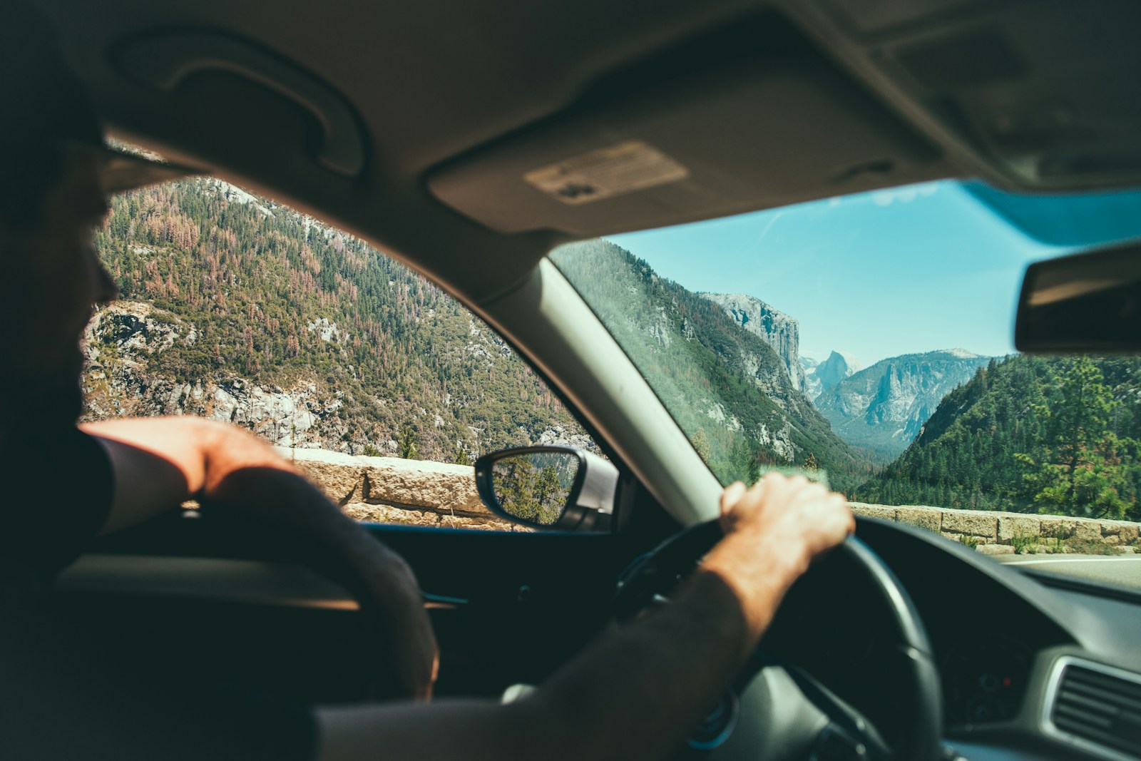smiling man while driving auto